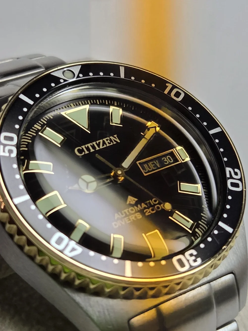 Citizen Black Dial Stainless Steel Diver Watch with Gold Accents